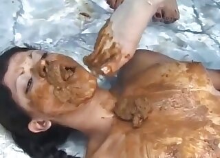 Group of people are covering the chick with feces
