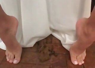 In the changing room where she can play with feces